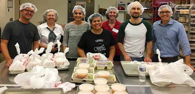 orrick cares feeding the hungry - orrick volunteers at a food kitchen